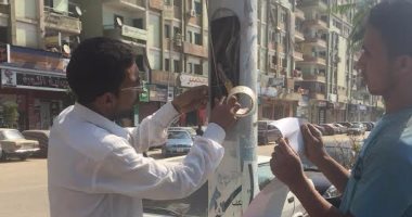 بالصور.. كهرباء أسيوط تغطى الأسلاك العارية لتجنب مخاطر السيول