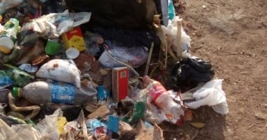 بالصور.. أهالى بولاق الدكرور يشكون من تراكم القمامة بشارع المشتل