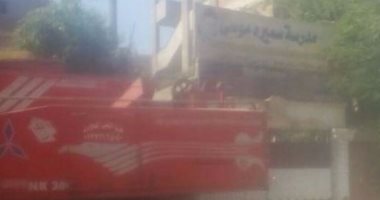 بالصور..أولياء أمور يطالبون بنقل جراج سيارات نقل مجاور لمدرسة أبنائهم 