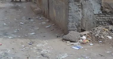بالصور.. أهالى حى رابع بدمياط يشكون سوء رصف الطرق وتراكم القمامة