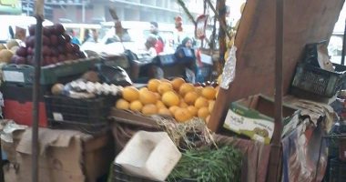 بالصور.. زحام مرورى بشارع العشرين فى فيصل بسبب الباعة الجائلين