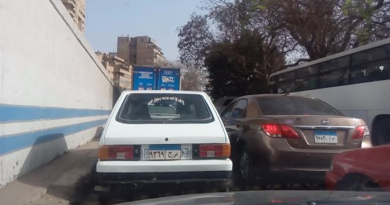 رفع 12 سيارة ودراجة بخارية مهملة فى حملات مرورية بشوارع الجيزة