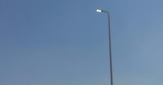 قارئ يرصد إضاءة أعمدة الإنارة نهارا بالطالبية فى الجيزة