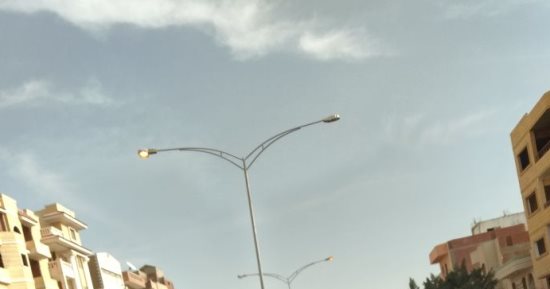 صور.. قارئ يرصد إنارة أعمدة الكهرباء نهاراً فى شوارع الحى الخامس بأكتوبر
