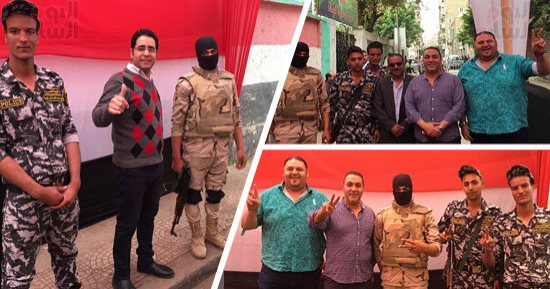 أهالى الأزبكية يرفعون علامة النصر بعد الإدلاء بأصواتهم بانتخابات الرئاسة