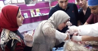 صور.. فريق بيطرى يستأصل ورمين من بطن كلب "لولو"