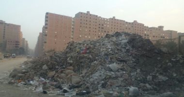  شكوى من تلال "  القمامة "   بشارع جسر السويس