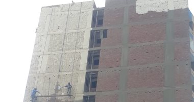 الجيزة تبدأ طلاء عقارات بجوار الطريق الدائرى فى نطاق حى العمرانية 