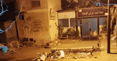 القمامة والكلاب الضالة تحاصر عيادة التأمين الصحى بالمهندسين