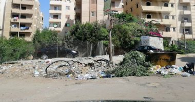 شكوى من وجود مقلب قمامة وسط كابلات كهرباء مكشوفة بالحى الثالث بأكتوبر