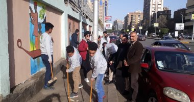 صور.. حوائط وأسوار شوارع الدقى تتحول للوحات فنية