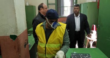 صور.. "نظافة الجيزة" تطهر المكاتب والجراجات للوقاية من كورونا