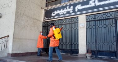 صور.. تطهير وتعقيم مبنى مجمع محاكم بلبيس بالشرقية  لمواجهة كورونا