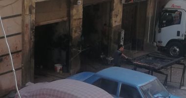 سيبها علينا..أهالى شارع حسن حلمى بحدائق حلوان يشكون من الورش الصناعية