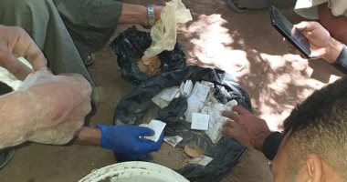 صور.. شباب البعيرات يستخرجون 70 عملا سحريا من مقابر قريتهم فى حملة نظافة