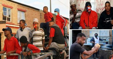 بأقنعة واقية ملونة.. عصابات جنوب أفريقيا توزع مساعدات غذائية على المواطنين بحجة أزمة كورونا.. أهالى كيب تاون: يحاولون الظهور بمظهر روبن هود ولا نصدقهم.. ما يلحقوه بالمجتمعات من ضرر لن يمحوه "رغيف خبز".. صور