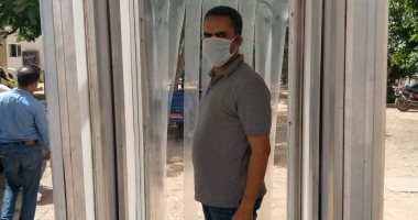 صور.. شركة مياه الشرب والصرف بإسنا تركب بوابة تعقيم لمكافحة كورونا