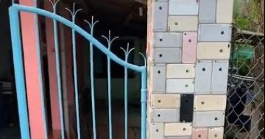 "لا طوب ولا رمل".. فيتنامى يحيط منزله بسور مصنوع من هواتف أيفون .. فيديو