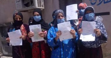  تسليم 320 إستمارة رقم قومي مجانية  لسيدات إحدي  قري بني سويف