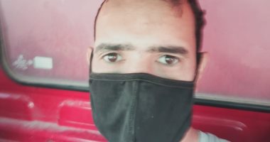 "أحمد" يشارك صورته بالكمامة خلال عمله بالجيزة والالتزام بالإجراءات الوقائية
