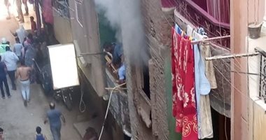قارئة تشارك بصور حريق اندلع بعقار فى شارع القومية بمنطقة إمبابة بالجيزة 