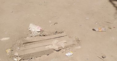 أهالى شارع محمد العبادى حى المطرية يشكون تكسر الطريق ووجود بلاعات مكشوفة