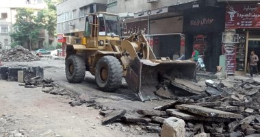 رصف شارعى قرة بن شريك وهمدان بجنوب الجيزة.. صور