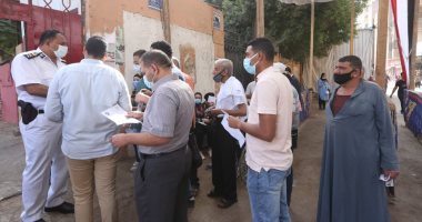 توافد الناخبين على لجان العمرانية والطالبية وسط إجراءات احترازية.. صور