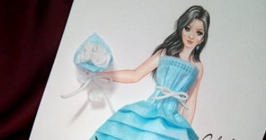 الماسك مش بس للحماية من كورونا.. "جهاد" رسمت وصممت فستان بالكمامة الطبية