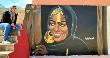 مها تنشر البهجة بشوارع أسوان بالرسم على جدرانها وتحضر لموسوعة جينيس