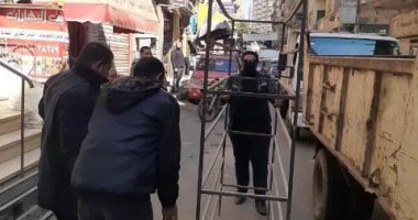 رفع الإشغالات والإعلانات غير المرخصة من الشوارع بمدينتى الزقازيق وبلبيس.. صور