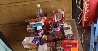 ضبط صيدلية تجرى مسحات كورونا بإمبابة وتلقى مخلفاتها بالطريق.. صور 