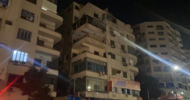 قوات "الحماية المدنية" تواصل تبريد موقع حريق عقار الدقى