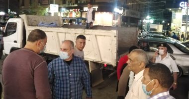 حملات بشوارع الأزبكية لغلق المحال والكافيهات تطبيقا للإجراءات الاحترازية.. صور