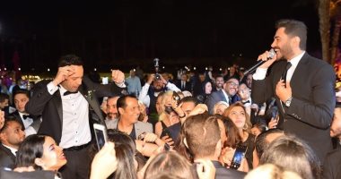 تامر حسنى يهنئ مصطفى قمر على زواج نجله إياد بصور من حفل الزفاف