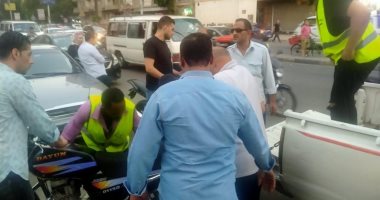 تحرير 15محضر عدم ارتداء كمامة وضبط 14سيارة ودارجه نارية مخالفة بالدقي.. صور