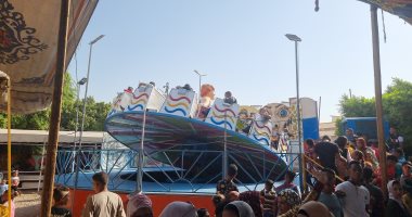إقبال المواطنين على الملاهى والألعاب فى ثان أيام العيد بسوهاج.. فيديو وصور