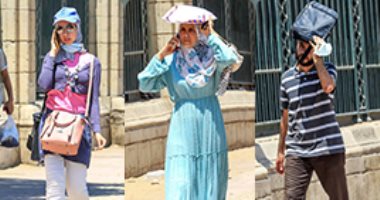 "شنطة.. وورقة .. وكاب" .. المواطنون يواجهون الحر