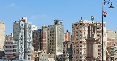 دهان العمارات المطلة على ميدان محطة مصر بالإسكندرية بلون موحد.. لايف وصور