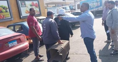 حملة لرفع الإشغالات فى أكبر موقف بالعاشر من رمضان.. صور
