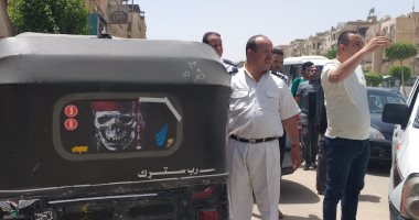 مصادرة 12 توك توك وتشميع 4 محال مخالفة ورفع 1130 إشغالا بحدائق الأهرام