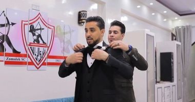 بحبك يا أبيض.. عريس أسيوط يصمم شقته بشعارات الزمالك ويحمل العلم فى شهر العسل