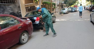 حى الدقى يشن حملة نظافة فى الشوارع.. صور