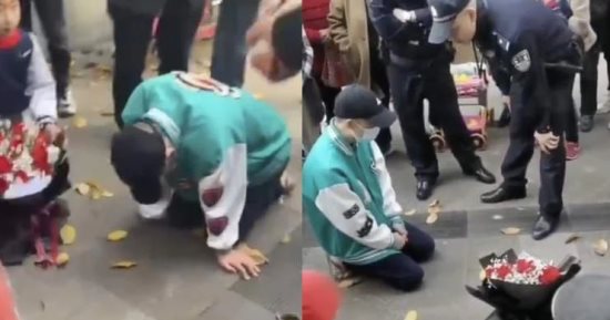 صينى يقضى 21 ساعة على ركبتيه أمام محل عمل صديقته السابقة والشرطة تتدخل
