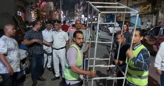 ضبط 16 سيارة ميكروباص مخالفة ورفع 131 حالة إشغال خلال حملة بالدقى 
