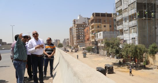 محافظ الجيزة يتابع أعمال طلاء واجهات العقارات المطلة على الدائرى نطاق الطالبية.. صور