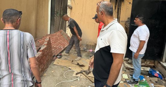 إزالة أعمال بناء مخالف بعقار فى حى الدقى.. صور