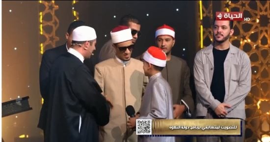 دولة التلاوة رحلة إبداع وفخر بالأصوات المصرية.. 5 متسابقين يتأهلون للحلقة الأخيرة وخروج محمود كمال.. الأزهرى يشيد بالمتسابقين.. مصطفى حسنى: كلما تأدبت وتواضعت أفاض الله عليّ بالنفع.. واحتفاء بالشيخ أحمد الرزيقى