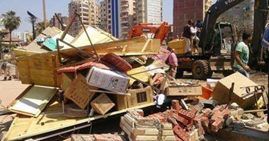 إزالة 18 حالة تعدى على حرم الطريق العام على نفقة المخالفين بالجيزة