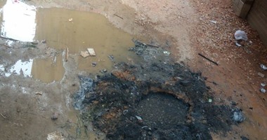 انسداد الصرف الصحى فى شارع حسين غلاب بفيصل والأهالى يستغيثون